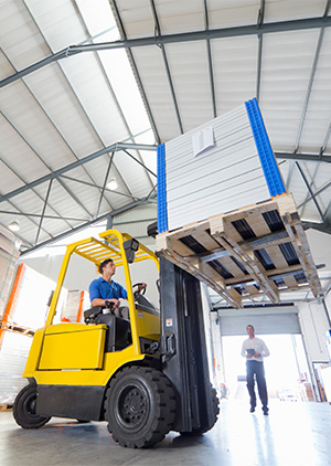 Businessman supervising forklift truck driver worker.