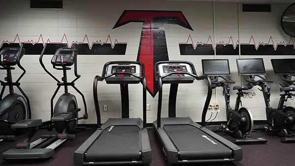 Photo of the Wellness Center elliptical machines, threadmills and stationary bikes.