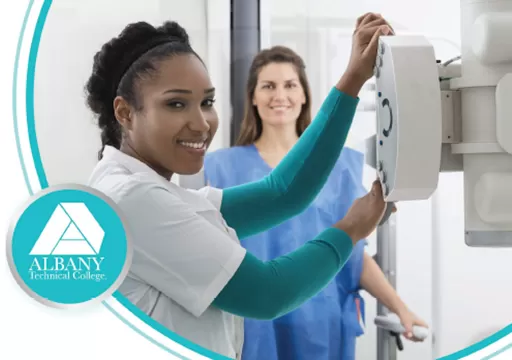 Image of a nurse setting up radiology equipment.