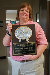 Tracie Naylor Griffin with EMS Educator of the Year Award.